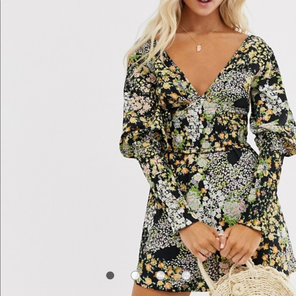 Floral romper. Very cute. Never worn with tags